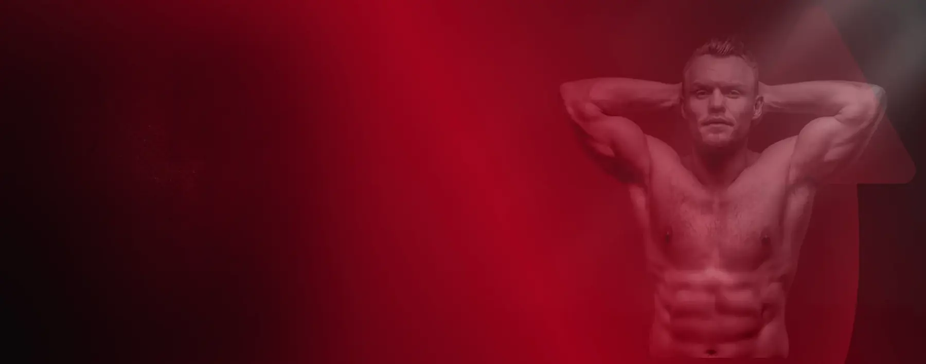 An active man in a red-lit gym, illustrating the everyday stamina Horsefil is formulated to support